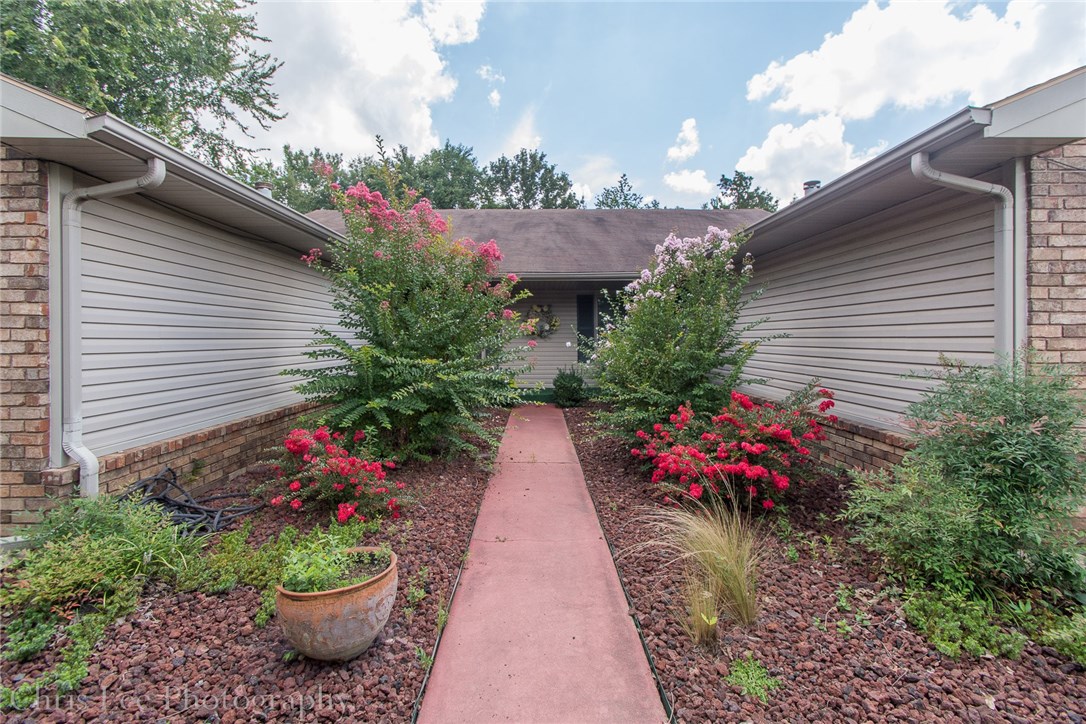 As nice of a 2 BR duplex as you’ll find in East Fayetteville! Recently painted interior, new vented microwave, stainless appliances, washer/dryer included, Plantation shutters throughout! Bedrooms are generously sized. Living room and dining area w/bar seating as well. Large pantry. Backyard paradise with dozens of perennials that bloom throughout the seasons. Large covered patio overlooks the fenced yard. Owner/agent lives on other side. 1 car garage with storage shelving.