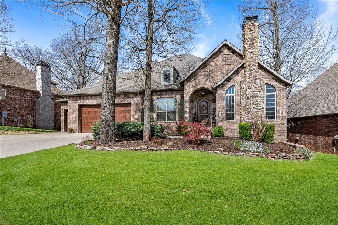 Welcome to Chapel Hill, located in the museum district, and one of Bentonville's most desired neighborhoods. It's filled with amazing homes and is close to downtown, Crystal Bridges, the Amazeum, the Home Health Institute and hiking and biking trails; all this and easy access to I-49. This home was a custom build in 2009 and has been meticulously maintained. The house features 2 bedrooms on the main level, a large and open living area with a gourmet style kitchen plus an office. On the lower level you will find 2 more bedrooms, a family room and a media room which could be a great craft room. You will love the multiple outdoor spaces to relax and enjoy the view, including a stone patio with firepit. The primary suite is oversized and features a large walk-in closet that connects to the laundry room. Come check it out today!