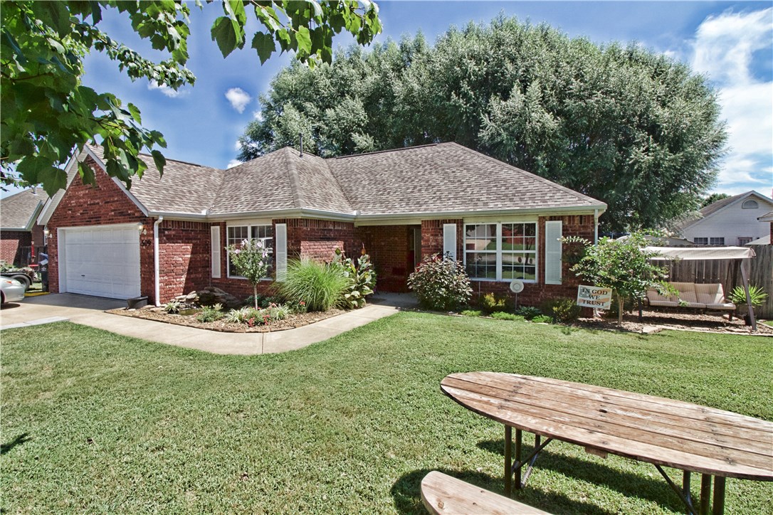 Convenient to all of NWA! Quiet, safe neighborhood. Built in 2000 1566sq ft. 4 bedroom 2 bath central heat and air gas fireplace. New roof in 2015! Backyard will be sodded and landscaped by seller as soon as possible. Attached garage Fully fenced back yard Mature trees in back for shade/privacy Deck Patio Shed Back yard to be sodded. Gorgeous landscaping throughout the outside of the home including a small pond! Sellers are very motivated. Schedule a showing today!