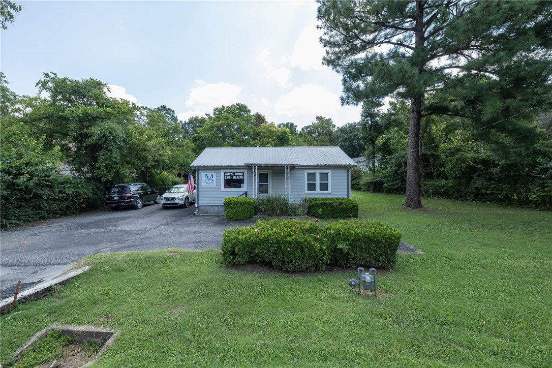 Excellent opportunity for office use or investment on a spacious 0.37-acre lot in a great location near the University of Arkansas, I-49, College Avenue, and North Street—just minutes from Wilson Park, restaurants, coffee shops, offices, multi-family developments, and the Fayetteville trail system. Zoned RSF-4 (Residential Single-Family, Four Units per Acre), the property has a history of commercial use and may offer potential for rezoning or a conditional use permit, though any future use would require city approval. Central heat was replaced in March 2025. Being sold AS IS. Buyer to verify all zoning and use possibilities. Currently tenant-occupied.