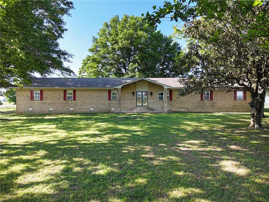 COUNTRY LIVING WITH BREATHTAKING VIEWS!! Beautiful 3 bedroom 2 bath brick ranch style home sitting on 4.5 acres with stunning 360 degree views of the mountains, rolling hills and pastureland. This home features a large family room, spacious kitchen with abundant cabinet space, dining area and granite countertops. New LVP flooring and fresh interior paint throughout. Large roomy bedrooms with plenty of closet space. Enjoy the outdoors from the partially covered deck, perfect for entertaining or taking in the scenery. Storm shelter included! Plenty of room to enjoy country living.