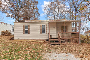 Looking for a cozy starter home near the Boone County Airport? Look no further! This charming 3 bedroom, 1 bath home is the perfect place to start your homeownership journey. With vaulted ceilings in the living room, the space feels open and inviting. Plus, the front deck is the perfect spot to relax and enjoy the neighborhood. Don't miss out on this wonderful opportunity to own your own home. Contact us today to schedule a viewing!
