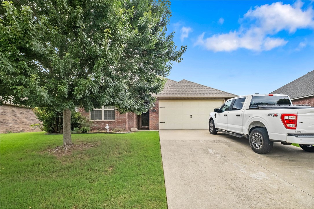 Welcome to this charming 3-bedroom, 2-bath home in the desirable Highland Square Greens community of Prairie Grove. Offering 1,405 sq. ft. of thoughtfully designed living space, this meticulously maintained home features a desirable split floor plan, spacious closets, and an open-concept layout perfect for everyday living. The kitchen is equipped with an electric range, cooktop, microwave vent, garbage disposal, and ample workspace for meal preparation. Enjoy relaxing evenings on the covered patio overlooking the landscaped lot. Built in 2014, the home also includes an attached 2-car garage, energy-efficient heat pump and wood burning stove. Nestled in a scenic valley with panoramic Ozark Mountain views, this community offers the perfect blend of peaceful country living with convenient access to shopping, dining, and city amenities. Preferred Lender credit available for qualified buyers through First Colony Mortgage.