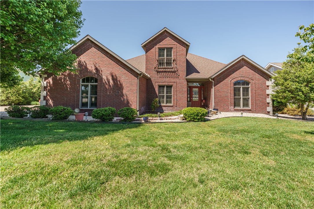 Conveniently located close to golf, shopping, and the main gate, this home offers comfort, style, and flexible living space. The main level features wood and tile flooring, a spacious living room with built-in shelving, propane fireplace, and electric blinds in the living and dining areas. The kitchen stands out with quartz countertops, stainless appliances, separate pantry with a beautiful glass door, and a new wine cooler. The primary suite includes a large walk-in closet and spacious bath with double vanity and large shower, along with access to the screened-in porch overlooking the golf course. The porch is also accessible from the living area, creating a great space for relaxing or entertaining. The main level also includes an office, additional bedroom, and full bath. Upstairs, the private guest suite with its own bath offers a comfortable retreat for visitors. Outside is an 8x12 storage shed with electric and a buried propane tank already in place. Thoughtful upgrades throughout.