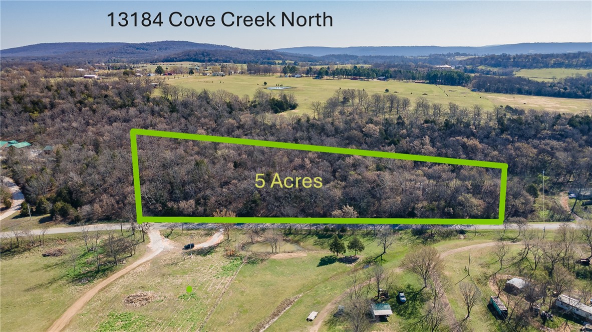 Welcome to 13184 Cove Creek North where the sunsets are absolutely wonderful. Discover 5 beautiful acres just south of Prairie Grove on Cove Creek North Rd, offering seclusion, scenic views, and a peaceful rural setting close to town. This property is ready for your dream home with a completed perc test, available water tap, and electric already on site—just bring your plans and get started. New survey on file. With a little clearing, you’ll enjoy stunning views and plenty of space for a shop, garden, or both. No covenants or deed restrictions provide flexibility to create your ideal retreat. Conveniently located less than a mile from the Prairie Grove bypass (E Heritage Parkway), just 5 minutes to downtown Prairie Grove, under 15 minutes to Fayetteville, and only 15 minutes to the Ozark National Forest for endless outdoor recreation.