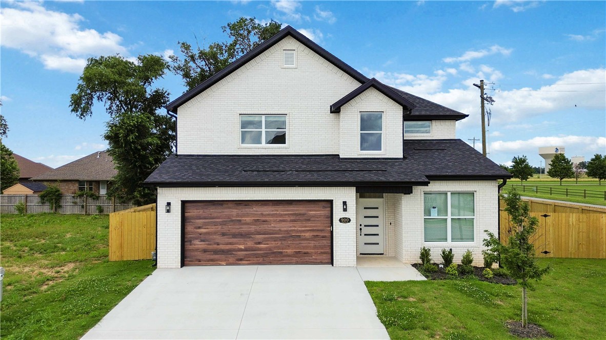 Experience the perfect blend of comfort and luxury in this stunning new construction corner-lot home featuring 4 bedrooms and 3.5 baths. Designed with thoughtful details throughout, the open floor plan is highlighted by soaring vaulted ceilings, custom cabinetry, elegant wrought-iron banister railings, and upscale finishes. The main level includes a spacious primary suite with a standalone soaking tub, tiled walk-in shower, dual vanities, and a walk-in closet. A dedicated office and half bath are also located on the main floor. The beautifully appointed kitchen showcases a designer backsplash and ample storage while opening seamlessly to the living and dining areas, creating an ideal space for entertaining. Upstairs, you'll find three additional bedrooms, including one with an en suite bathroom and a walk-in closet, making it an ideal guest suite. Additional features include an EV charger in the garage and a fenced backyard. This exceptional home combines modern style, functionality, and craftsmanship throughout.
