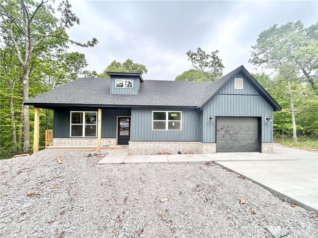 Discover this stunning craftsman style new construction home on a large .32-acre wooded lot, just moments away from Branchwood Recreation Center, Lake Loch Lomond, Highlands Golf Course, and I-49! This exquisite home boasts high-end finishes throughout! Step inside to find a stylish open-concept layout, adorned with NO carpet. The focal point of the home is the kitchen, equipped with custom cabinets, 3cm quartz countertops, and a large kitchen island. Retreat to the primary bath, where you'll find a spacious walk-in tile shower and double vanity. 2 bedrooms / 2 baths. Schedule your showing today!