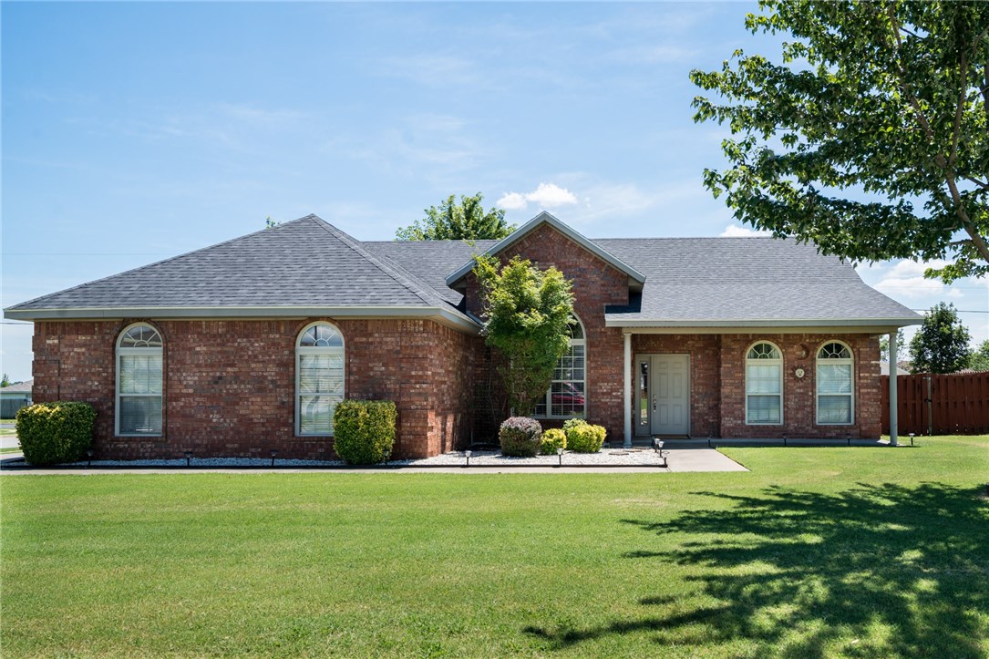 3 bedroom, 2 and a half bath on a corner lot that is move in ready! Well maintained home in the middle of North West Arkansas.  No carpet here!!! Wood, tile and glass floors throughout home. Very well maintained in a quiet neighborhood. Low maintenance all brick exterior.  According to Google maps, home is located 22 minutes from the Walmart Home office and 25 minutes from Fayetteville. Home is eligible for 100% financing. One Year Home Warranty to be paid by Sellers! Schedule your private showing today!