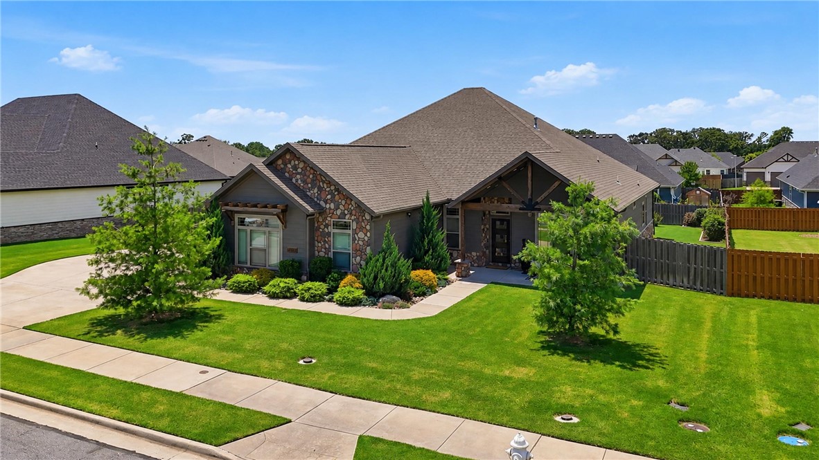 This stunning luxury Bentonville residence perfectly blends everyday function with resort-style living. Inside, you are greeted by a luxurious, spacious living room with an open-concept great room space that flows perfectly for everyday life & seamless entertaining. The true chef’s kitchen is fully equipped with top-of-the-line appliances, expansive granite island & walk-in pantry. Designed with function & convenience in mind, this home includes two extra deep garages for 3 cars, dedicated office & a very large laundry/mud room. Need versatility? The over-sized 200sqft 4th bedroom can be used as a flex space, 2nd living room or bonus room—perfect for a home theater or a gym.  Step outside into your own private backyard paradise. Designed for year-round outdoor relaxation & entertaining, the exterior oasis features a private in-ground heated pool, fully equipped outdoor kitchen & a large, covered patio + pergola space. This home truly has it all—don't miss your chance to own a Bentonville masterpiece.