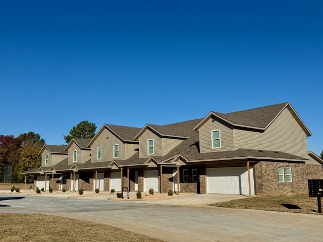 Welcome to this modern 3-bedroom, 2.5-bath townhome offering around 1,300 sq. ft. of living space and a 2-car garage. Includes fridge, dishwasher, stove, washer, and dryer for easy move-in! Pets allowed with owner approval, and lawn care is provided. Enjoy quick access to Downtown Rogers, Lake Atalanta Park, Pinnacle Hills Promenade and Downtown Bentonville for shopping, dining, and entertainment. Water, sewer & trash are included. **Pics may not be of exact unit. **This is new construction and the availability is an approximate date and cannot be guaranteed**