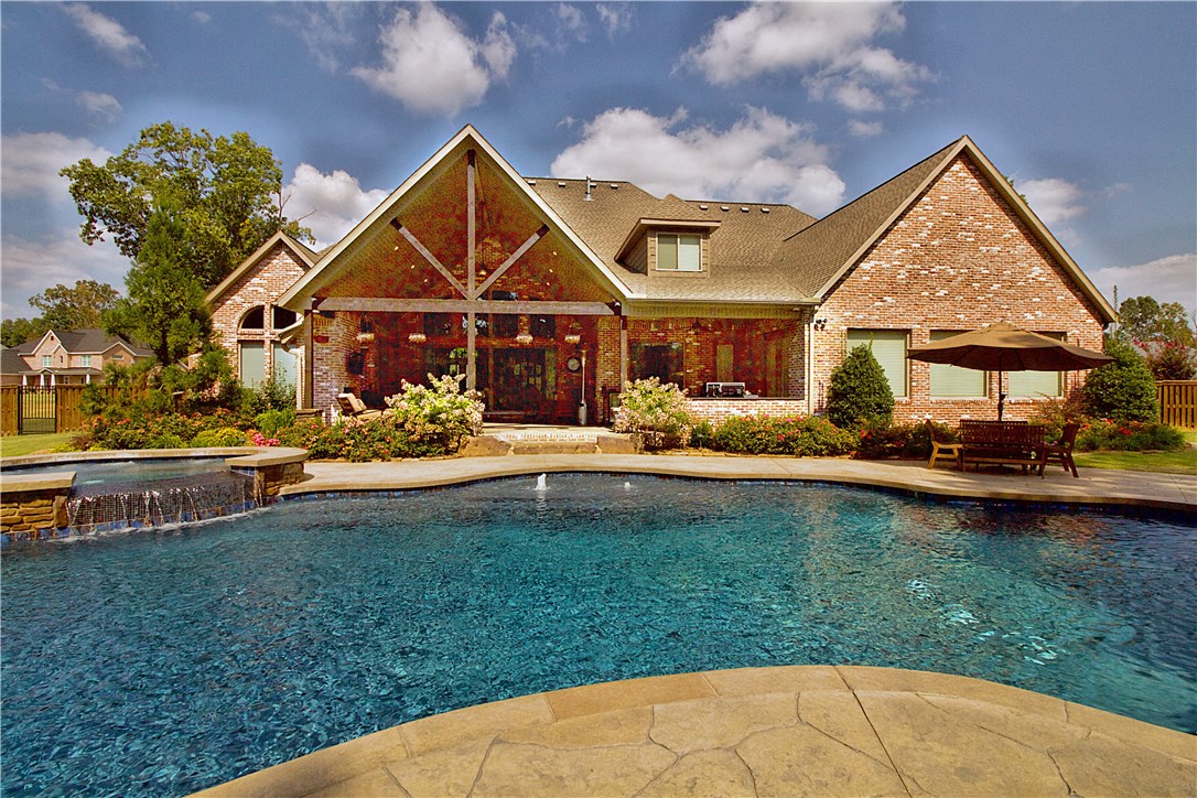 Resort style pool and backyard area, private grata waterfall, the real deal man cave with audio and hook ups for 3 wall mount tv's. amazing office, butlers pantry, mudroom, laundry room and hobby room, 4 car garage, custom light fixture package. hot tub, outdoor kitchen and living room, with wood burning fireplace, large fenced in area with room to grow...and hunt if you like that sort of thing ;);) TV's and media equipment do not convey.