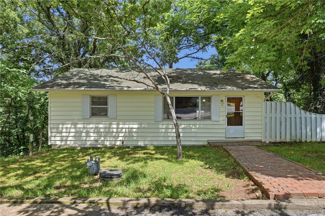 Great opportunity for a first-time homebuyer, investor, or anyone looking for an affordable home in the heart of Eureka Springs! Tucked away on a quiet street, this 3-bedroom, 1.5-bath home offers a convenient location just minutes from downtown, grocery stores, restaurants, and everyday amenities. Inside, you’ll find a spacious living room, functional kitchen, and two generously sized bedrooms on the main level. The finished basement provides additional living space complete with a cozy wood-burning stove, a third bedroom, plus a single-car garage for storage or parking. Step outside to enjoy the small deck overlooking the valley behind the home, offering a peaceful setting to relax and unwind. Whether you’re searching for a primary residence, long-term rental, or investment property, this home offers plenty of potential in a desirable Eureka Springs location.