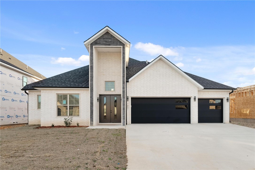 Location matters, and this one delivers! 1851 Lotus Road is in Silver Leaf Estates, a growing community zoned to Bentonville Schools with access to a clubhouse, pool, fitness room, walking trails, pond, and dog park. Three bedrooms on the main level include a private primary suite set apart for added privacy. The living room has custom built ins and a gas fireplace and opens to the kitchen with quartz counters, custom cabinetry,  large island, pantry, and designer lighting. The primary suite offers a spa style bath with walk in shower, large tub, and oversized closet. Upstairs, a large bonus room, additional bedroom, and full bath provide flexible space. Convenient location less than 20 minutes to Downtown Bentonville and new Walmart Home Office, and under 15 minutes to XNA. Up to $5,000 is also available toward closing costs, prepaid items, or a rate buydown with preferred lender financing. Privacy fence to be installed soon!