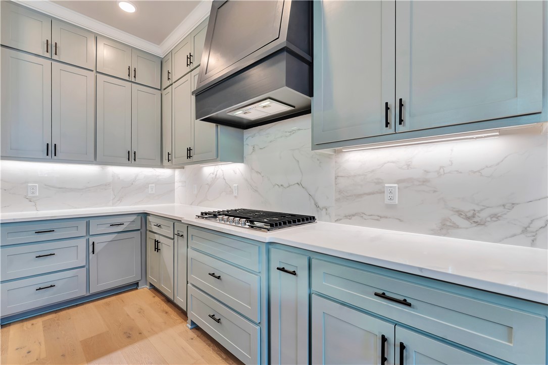 Location matters, and this one delivers! 1851 Lotus Road is in Silver Leaf Estates, a growing community zoned to Bentonville Schools with access to a clubhouse, pool, fitness room, walking trails, pond, and dog park. Three bedrooms on the main level include a private primary suite set apart for added privacy. The living room has custom built ins and a gas fireplace and opens to the kitchen with quartz counters, custom cabinetry,  large island, pantry, and designer lighting. The primary suite offers a spa style bath with walk in shower, large tub, and oversized closet. Upstairs, a large bonus room, additional bedroom, and full bath provide flexible space. Convenient location less than 20 minutes to Downtown Bentonville and new Walmart Home Office, and under 15 minutes to XNA. Up to $5,000 is also available toward closing costs, prepaid items, or a rate buydown with preferred lender financing. Privacy fence to be installed soon!