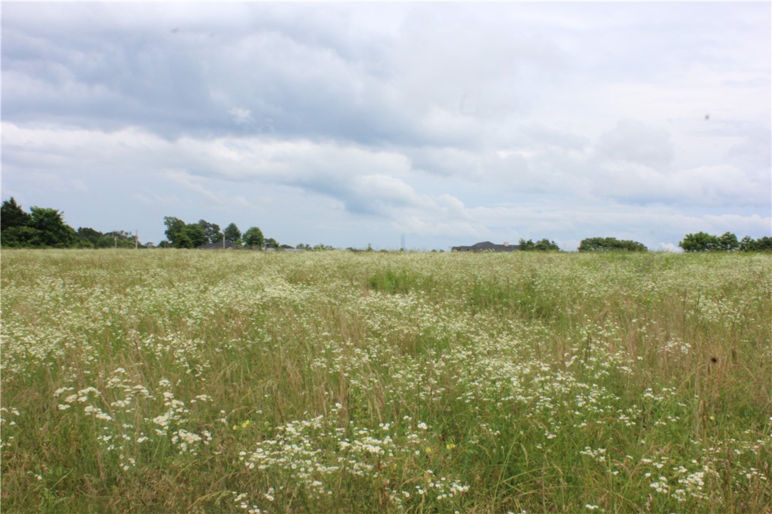 Nice cleared 4.04 acres to build your dream home, minimum 1750 sq ft home required to build. No manufactured homes. Electric and water at street, septic will be needed.