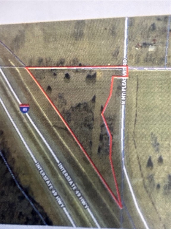 Check out this amazing opportunity! Almost 3 acres subject to survey currently zoned AG. So close to Interstate 49 that it has Interstate frontage! Future Potential for commercial or potential residential! Perfect for someone that wants to build their dream home and be literally 2 mins from getting on the interstate. Or think of the future commercial value! Either way this property is a win, win. In City limits of Gravette.