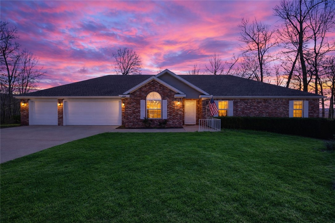 Tucked away on 1.15 acres near beautiful Beaver Lake, this spacious home offers the perfect blend of privacy, comfort, and everyday convenience. The 4-bedroom, 2.5-bath residence with approximately 2,238 sq ft features a welcoming layout designed for relaxed living and entertaining. The kitchen includes granite countertops, pantry storage, and an eat-in dining area, opening to a comfortable LR with gas-log fireplace—perfect for cozy evenings at home. Step outside to expansive multi-level decks, idealfor morning coffee, weekend gatherings, or simply enjoying the peaceful wooded surroundings. The generous lot provides room to spread out while still being easy to maintain. Located just minutes from Beaver Lake marinas, parks, and outdoor recreation, and convenient access to shopping, dining, schools, and Rogers amenities. Whether you enjoy boating, fishing, hiking, or simply relaxing in nature, this location supports an active and balanced lifestyle. A rare opportunity to enjoy lake-area living with space and privacy.