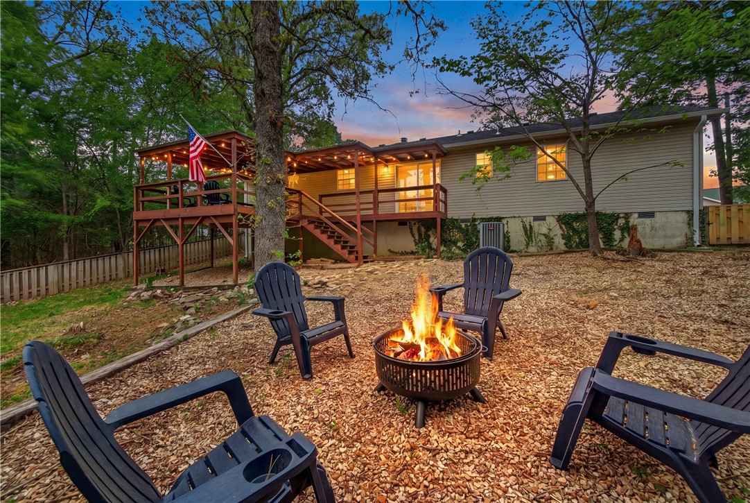 Lake life without the long drive home. This recently renovated 3 bed, 2 bath home sits in a Prairie Creek subdivision with a community boat launch, putting Beaver Lake just minutes from your door. The backyard is where this one earns its keep: a covered deck and patio with seasonal lake views and plenty of room to unwind. The new roof is a welcome upgrade that should help keep insurance premiums in check. Inside, tall living room ceilings open the space up, with a wood-burning fireplace anchoring the corner. Granite countertops run throughout, with ceramic wood-plank tile flooring that holds up to everything lake life throws at it. The location is hard to beat: 10 minutes to downtown Rogers for dining and shopping, 15 minutes to Hobbs State Park for hiking and trails, and the lake just around the corner. You get easy access to the outdoors without giving up the convenience of town. A great fit for anyone looking to enjoy the lake lifestyle while staying close to everything Northwest Arkansas has to offer.