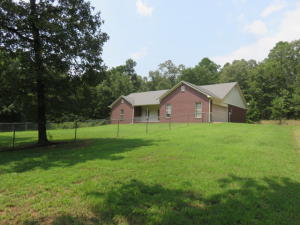 UPSCALE, COUNTRY LIVING in this custom built dwelling! Just outside city limits! Prestigious, all electric home has incredible living space, OPEN FLOOR PLAN, cathedral ceiling in LR! BRAND NEW CENTRAL HEAT/ AIR SYSTEM. 9 foot ceilings throughout. Master suite has several closets! Laundry room with sink! Hosting large bedrooms & open floor plan! Fenced yard for the canines! 16' x 20' Utility building.