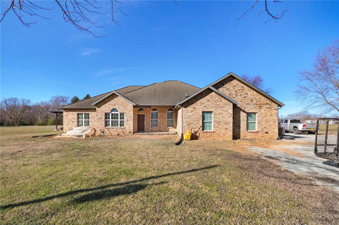Too good to be true! That's this one! 5 bedrooms, 3.5 baths, fully able to provide living space for 2 separate families with a lower and upper level(s) offering 2 separate kitchens, living spaces, 2 fireplaces, sitting on 3 ac mol (additional 2 ac mol is available with additional funds), there are solar panels (to be paid off at the time of closing), lots of natural light and beautiful windows, this property is very welcoming, it has a lot of character and will be the perfect fit for a growing family, blended family, host family, foster family, in-law or college students, OPPORTUNITIES ARE ENDLESS, have room for a garden, livestock! This property is on septic and well water (public water is at the road - buyer to verify availability), propane tank too. Stunning opportunity for the perfect family looking for SPACIOUS living! Easy access to Gentry or Siloam not too far from the private school! SF is per seller (seller states over 5k, different from tax card).