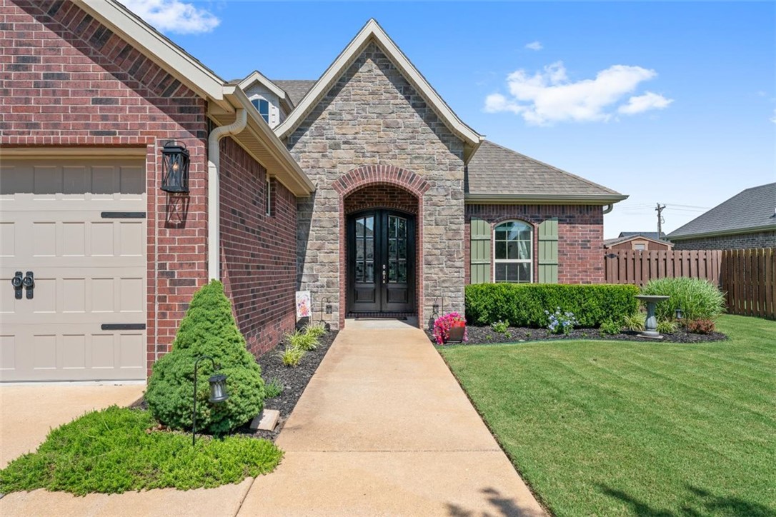 Your dream oasis awaits at 5909 S 66th Street in Cave Springs. This stunningly updated home blends modern luxury with a private, resort-style backyard. Step inside to find a bright and airy interior illuminated by brand-new energy-efficient windows. Gorgeous new engineered hardwood floors flow seamlessly through the main living spaces, leading you into a transformed chef’s kitchen complete with new custom cabinets that offer sleek, premium storage. Outside, the property transforms into an entertainer’s paradise. You can dive into the pristine in-ground, smart, saltwater pool, which features a high-efficiency heat pump to cool or heat the water for a perfect swim in any season. Next to the pool, you can relax under the shade of a designer pergola or gather around the majestic outdoor brick fireplace on cool evenings. Located just minutes from top Northwest Arkansas amenities, this meticulously renovated home is completely move-in ready and offers everything you’re looking for, at a very friendly price.