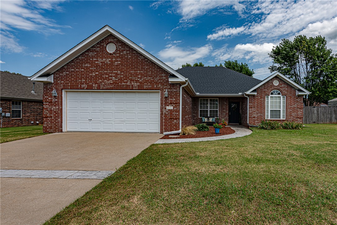 WELCOME HOME! This 3 bedroom 2 bath home  located just minutes away  from schools ,shopping, parks , and eateries Is exactly what you’ve been looking for! From the covered front porch head inside to the  foyer featuring wood flooring and crown molding which leads into the living area featuring vaulted ceilings, ceiling fan, electric log fireplace with marble detailing, and wood laminate flooring! Head into the L-shaped kitchen and eat in dining room featuring crown molding, tile flooring, tile countertops, natural wood cabinetry, stainless steel appliances and counter height bar perfect for hosting!Relax and rejuvenate in the primary suite featuring a private ensuite w/ dual sink vanity,  dual closets, and whirlpool tub and shower combo! Enjoy an additional two bedrooms, one bathroom! Head out back to the large stamped concrete patio overlooking the manicured fenced in back lawn! Don’t miss out! Act Now!