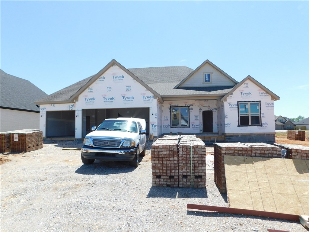 Beautiful new home features 2,415 sf, 4 BR, 3 BA, 3 car garage, wood floors, covered patio, office & open floor plan for entertaining. The wood beams on the ceiling create an inviting living area. The kitchen features granite, under mount counter lighting, gas stove-top & stainless steel appliances. The master suite has a walk-thru closet to the laundry room, walk-in tile shower & double vanity. Nice community pool and easy access to I-49 & Hwy 412.