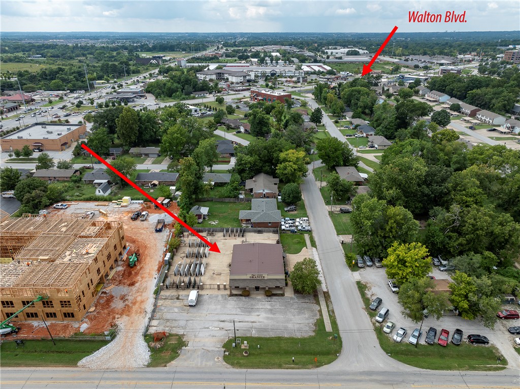 HARD TO FIND IN BENTONVILLE! AMAZING LOCATION ON THE CORNER OF SW A ST AND SW 12TH ST! IT IS ZONED DC, DOWNTOWN CORE! SW 12th St HAS ACCESS TO WALTON BLVD.  Prime commercial property located near one of Bentonville's busiest intersections, SW A Street and SW 14th Street (Hwy 102). This 3000 sq.ft. building sits on 0.60 of an acre, has 6 offices, a huge display/reception area, 475 sq ft storage/warehouse area and two restrooms. It has an entrance off of A street as well as 12th st and is less than one mile from downtown Bentonville and minutes away from the new Walmart Campus, Regional Airport, and I-49. This location is excellent for retail, mixed use, office, restaurant, etc. and offers amazing potential in a fast growing area close to many established businesses and new development. Do not miss this opportunity to be part of Bentonville, a city that has unbelievable growth and success!