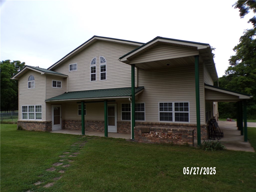 Located just of Hwy 62 North end of Rogers. Ideal location for a home/business set up. Home has large living room with cathedral ceilings and 2 story fireplace. Loft area and attached 2 car garage with enough room to park RV. There is a attached in laws suite with living area and kitchenet, full bath and bedroom. Or use it as a office set up. Plenty of room to build a shop building or park equipment.