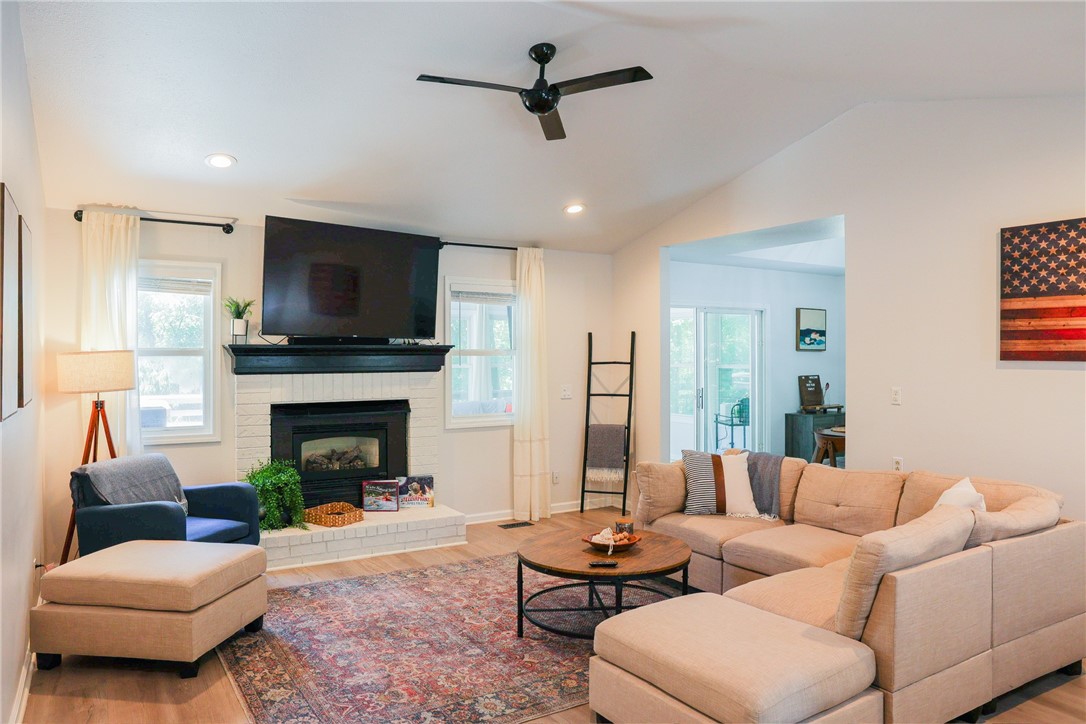 Furnished!!! Upscale Bella Vista rental nestled in a wooded setting just moments from Back 40 Trail and Blowing Springs Park—perfect for biking, hiking, and outdoor recreation. This beautifully updated home features bamboo hardwood flooring throughout the main living areas and bedrooms, with tile in the bathrooms, laundry, and sunroom. Enjoy a vaulted ceiling and cozy gas fireplace in the living room, a stylish eat-in kitchen with painted white cabinets, stainless steel appliances, countertop seating, and walk-in pantry. The dining area includes a tray ceiling and glass door opening to a bright sunroom. The main suite offers a tray ceiling, bay window, and private bath, with two additional bedrooms and full bath nearby. Lower-level storage/shop studio adds extra space. Modern updates include new flooring, lighting, faux wood blinds, hardware, Nest thermostat, smoke and carbon detectors, and more. Enjoy comfort, style, and convenience in the heart of Bella Vista near top trailheads and parks. Comes furnished.