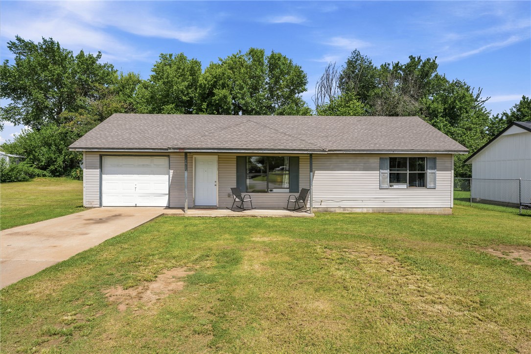 Welcome home to this well-maintained 2-bedroom, 1-bath home situated on a spacious 0.35-acre lot in an established Siloam Springs neighborhood. The converted garage provides a versatile bonus space perfect for a second living area, home office, playroom, or hobby room. Recent updates include a newer roof, windows, HVAC system, oven, dishwasher, and fresh interior paint, offering peace of mind and move-in-ready convenience. Outside, you'll appreciate the generous backyard with plenty of room to garden, entertain, or simply enjoy the outdoors. Conveniently located just minutes from downtown Siloam Springs, local parks, schools, shopping, dining, and everyday amenities, this home combines comfort, functionality, and an excellent location for first-time buyers, downsizers, or investors alike.