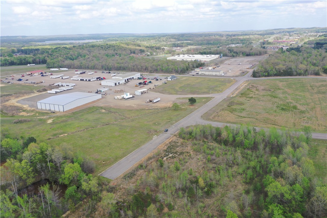 This 8+ac commercial property offers an exceptional opportunity for businesses seeking a strategic location with prime visibility and accessibility. Situated just minutes from Interstate 40, the property provides easy on/off access to one of the region's busiest highways, making it an ideal choice for companies looking to expand or establish operations in a high-traffic area.
Located at the end of a quiet street within an established industrial park, the site benefits from a peaceful yet accessible setting with direct proximity to major industrial and commercial hubs, including Vinh Long and Robinson Enterprises. The property’s size and zoning are well-suited for a variety of commercial, industrial, or warehouse use