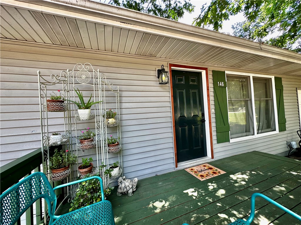 Welcome home! Modern living meet serenity in this charming home. Fully renovated in 2020! Positioned just 6 miles from the vibrant, historic streets of downtown Eureka Springs & right near the 19 hole pro golf course, this beautifully decorated property provides the ultimate balance of quiet natural beauty & convenient access to local culture. Inside, you will find an entirely refreshed interior highlighted by wood burning fire places, updated bathrooms & modernized kitchen with sleek granite countertops. The thoughtful layout offers plenty of space to stretch out, featuring a second cozy living room and a lower-level master suite that walks out directly to the peaceful outdoors (perfect for a private spa area)! Beyond the front door, Holiday Island community invites you to enjoy premium amenities like golf courses, hiking trails, a community pool, & easy access to Table Rock Lake. This move-in-ready gem is as cute as it is functional, making it the perfect full-time residence, STR or lock-&-leave mountain getaway.