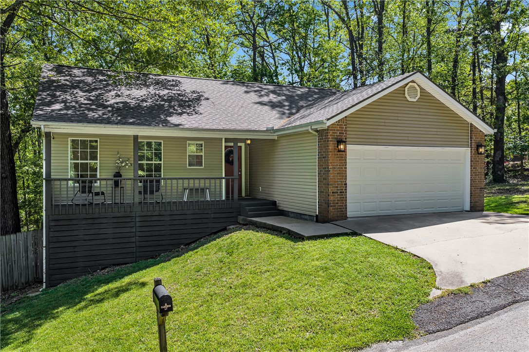 Tucked away on a quiet cul-de-sac in Bella Vista's Buckingham subdivision, this charming 2-bedroom, 2-bath ranch with a bonus office is the one you've been waiting for. Just steps from Lake Ann and walking distance to the Back 40 Buckingham Trailhead, the location is hard to beat. Inside, you'll find 1,264 sq ft of comfortable living space featuring Pergo luxury vinyl plank floors, walk-in closets, ceiling fans, and a functional layout that just makes sense. The kitchen comes fully equipped with all appliances included. Step out back to your private deck — perfect for morning coffee or evening unwinding. The attached 2-car garage adds everyday convenience. With a $45/month HOA, you'll enjoy access to Bella Vista's incredible amenities including pools, tennis, pickleball, a clubhouse, boat dock, and miles of trails. This one checks every box!