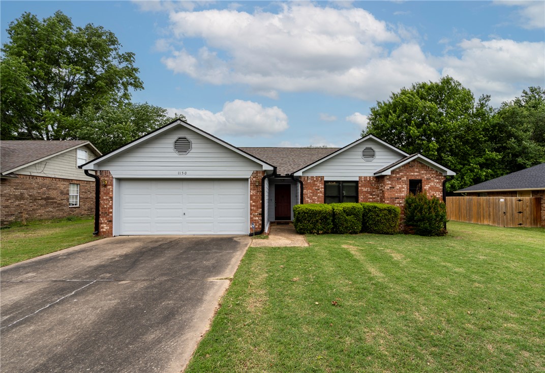 Welcome to 1150 S Lyndale, a ready-to-move-in single-family residence in Siloam Springs, Arkansas. Built in 1993, this inviting home offers 1538 square feet of comfortable living space, designed for modern ease and everyday enjoyment. New roof, gutters and exterior trim paint make this property a great opportunity or first-time home buyers or families downsizing. Located on a cul-de-sac with a large .25 acre lot with a fenced backyard and patio, this home offers an established neighborhood and lots of area to grow.  Anderson double pane windows throughout.  Newer Bosch dishwasher in eat in kitchen and separate den/dining area and vaulted ceiling in living area.  Newer washer, dryer and refrigerator can convey. There two hall storage closets in addition to the coat closet in the entryway.  This home offers a split floor plan and walk in closet in main bedroom.  See for yourself if this is the place you can call home.