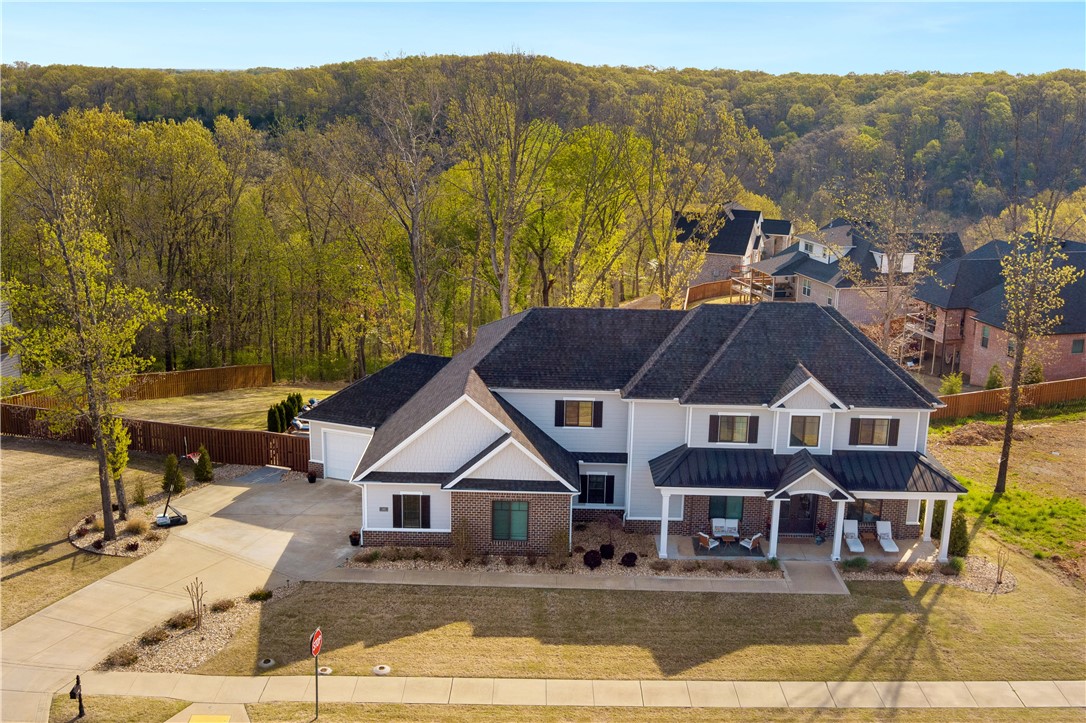Welcome home to 1800 NW Angel Falls Rd! If you've been looking for a home with a backyard that says "welcome to our little piece of paradise", here it is! A 2016 custom build by Homes of Distinction featuring 5 bedrooms, 4.5 bath & extensive details you won't want to miss. The elegant, inviting living space is lined with floor to ceiling windows welcoming the outdoors in. The chefs kitchen boasts a hidden pantry with cabinet door entry & appliance outlets. You will be immediately drawn to the outdoor oasis & the elegant architectural design just steps from the Coler Bike Trail. Ask to see the features sheet for a full list of all the extras this home offers. Call & scheduled to see this one today!