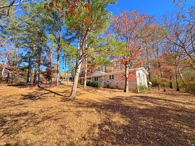 HUGE price drop, Ready to sell quick! 
Home will be sold as is.
This one family owned, beautiful 3 bed, 2 bath home on 1.24 acres with all the extra space you’ve been looking for. With 1,484 sq ft on the main level plus a walk-out basement for additional storage, this one gives you room to breathe. The home features a metal roof, a cute covered front porch, and a large two car carport to keep you out of the weather. Inside, you’ll find a comfortable layout, a cozy wood-burning fireplace, and easy access to the outdoors. Need workspace? You’ll love the 468 sq ft detached shop, perfect for projects, hobbies, or extra storage. Property is on city water and sewer, giving you the convenience of town with the space of country living. A well cared for home with land at an affordable price. Come see it in person and imagine the possibilities!
