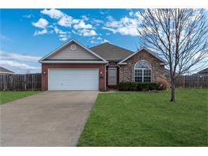 Gorgeous home in the Oaks Subdivision. Features include 3 bedrooms. 2 full baths. Beautiful hardwood flooring in living area and wood burning fireplace. Spacious Master bedroom with large walk in closets, double vanity sinks, garden tub and walk in shower. HUGE privacy fenced back yard for entertaining!!