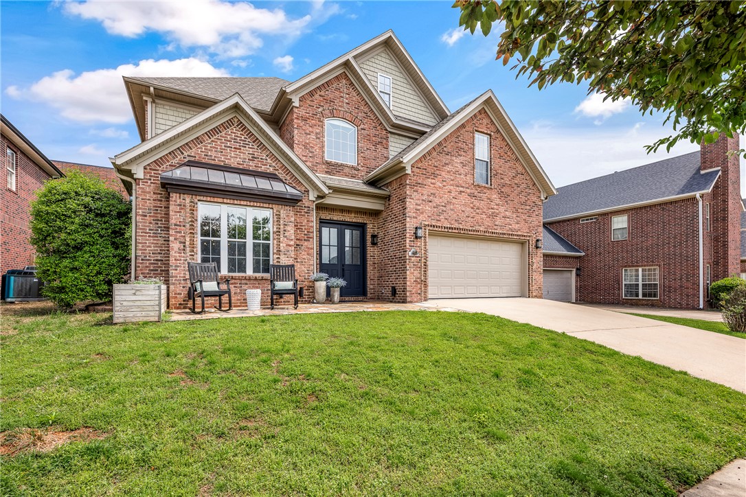 Discover this stylishly renovated home in the heart of downtown Bentonville, just a short walk from  The Momentary, 8th Street Market, the downtown square, and trails! Enjoy quick access to the Walmart Campus, Crystal Bridges, and I-49! This spacious residence boasts 4 bedrooms and 4 full baths, complemented by a bonus room, a flex space, and a formal dining area. The home seamlessly blends modern style with everyday comfort. Refinished hardwood floors grace the main level, while the kitchen showcases a stunning custom island with Dolomites countertops, updated cabinetry, new Fisher & Paykel stainless steel appliances, and refined granite countertops. The reimagined primary bathroom features a luxurious soaker tub, upscale countertops, and custom vanities. High-end curated finishes and abundant crown molding add an elegant touch throughout the home. The exterior includes irrigation, refreshed landscaping, stone patios, and a fenced-in backyard, perfect for outdoor gatherings. Schedule your showing today!