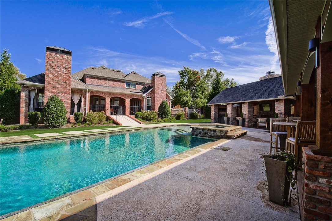 Beautiful & Elegant Estate Home in Highly Sought Out Pinnacle Golf & Country Club.  This Home is Great for Entertaining w/Fabulous Outdoor Living Area w/Outdoor Fireplace, Gorgeous Heated Pool w/Hot Tub, Waterfall, Pool Bathroom & Exercise Rm.  This Estate Home Offers a Detached Pool House w/its own European Kitchen & Bedroom & Full Bathroom & Living Area & Laundry Rm.  Main House offers Versatile Floor Plan w/Cozy Family Rm off of the Kitchen and Formal Living Rm w/High Ceilings & Full Views of the Pool, Elegant Dining, Private Office w/French Doors, Hardwood throughout Main Level, High Ceilings, Beams, Bonus Upstairs, Master on the Main, and Large Size Secondary Bedrooms on 2nd Level. In-Law Apartment/Pool House Has 1,500 sf (923 heated and cooled and 700 covered) of Living Area.  Located in Bentonville Schools District & All the Amenities the Neighborhood has to offer. Don’t Miss Out !! Fantastic Price for this Estate Home !!
