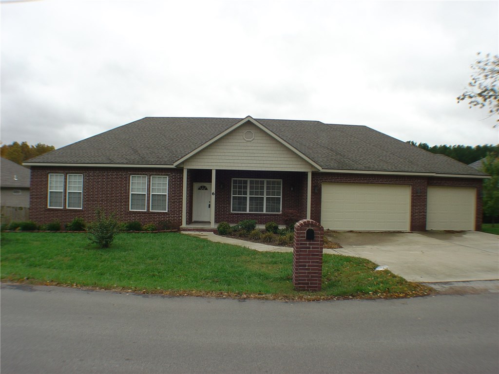 Beautiful Newer Home With Hardwood Floors, Hard Surface Counters, Open Floor Plan, 3 Bedrooms Plus An Office, 2.5 Baths, Huge 3 Car Garage, Covered Back Deck W/Fan, Propane Heat, Level Yard, Close To Town, Executive Living At An Affordable Price!