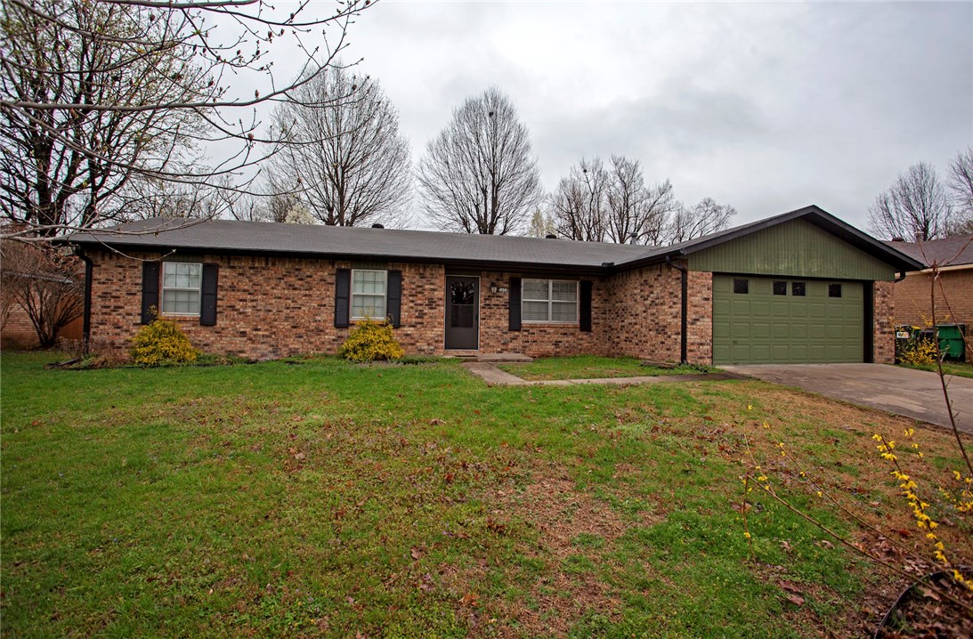Great home in Springdale close to I-49. 3 bedroom 2 bath home has Vinyl plank flooring in main living area and carpet in bedrooms. Home has formal living room and a large family room with a gas fire place. Large fenced back yard with storage building, 2 car garage.