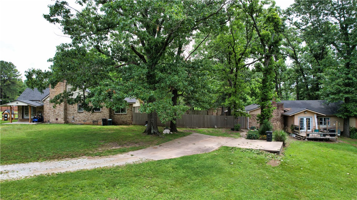 Rare Investment Opportunity in Rogers! Discover the endless potential of this incredible 5+ acre property featuring two homes, perfectly situated just minutes from both vibrant downtown Rogers and the shores of Beaver Lake. Home 1: A charming, move-in-ready ~1,300 sq ft residence boasting 3 bedrooms and 1 bathroom. Enjoy a beautifully updated kitchen and a recently modernized bathroom. Home 2: A ~1,200 sq ft home in need of TLC—ideal for a fixer-upper project, guest house, or rental income. Currently zoned Residential Agriculture, the land offers immense flexibility: it could potentially be rezoned to Commercial or split into five separate 1-acre lots for development. Buyer to verify all zoning changes and lot split requirements with Benton County. Whether you want a private homestead with acreage or a prime development project, this property is a must-see. Open/Wooded acres are approximate. Also listed as MLS 1353461.