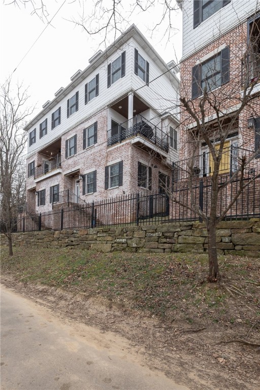 Amazing tri-level townhome in the coveted Wilson Park area! This beautifully updated three-story home features a private elevator, two primary suites, and a private balcony overlooking the park. The living room offers a cozy gas fireplace, while the kitchen is equipped with a large bar and stainless steel appliances. Hardwood floors, granite countertops, and new fixtures add to the modern feel, and the refrigerator, washer, and dryer all convey. A rare combination of style, comfort, and location—this one is a must-see.