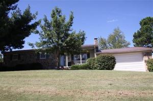 Pretty 3 BR, 2 BA home on a large corner lot beautiful view of the golf course! Features include newer windows, metal roof, AC, flooring, etc.  There's also a basement that would be a great spot for teens,with a den and bedroom area.Super location!! HOUSE IS OCCUPIED< MUST MAKE APPOINTMENT TO SHOW!