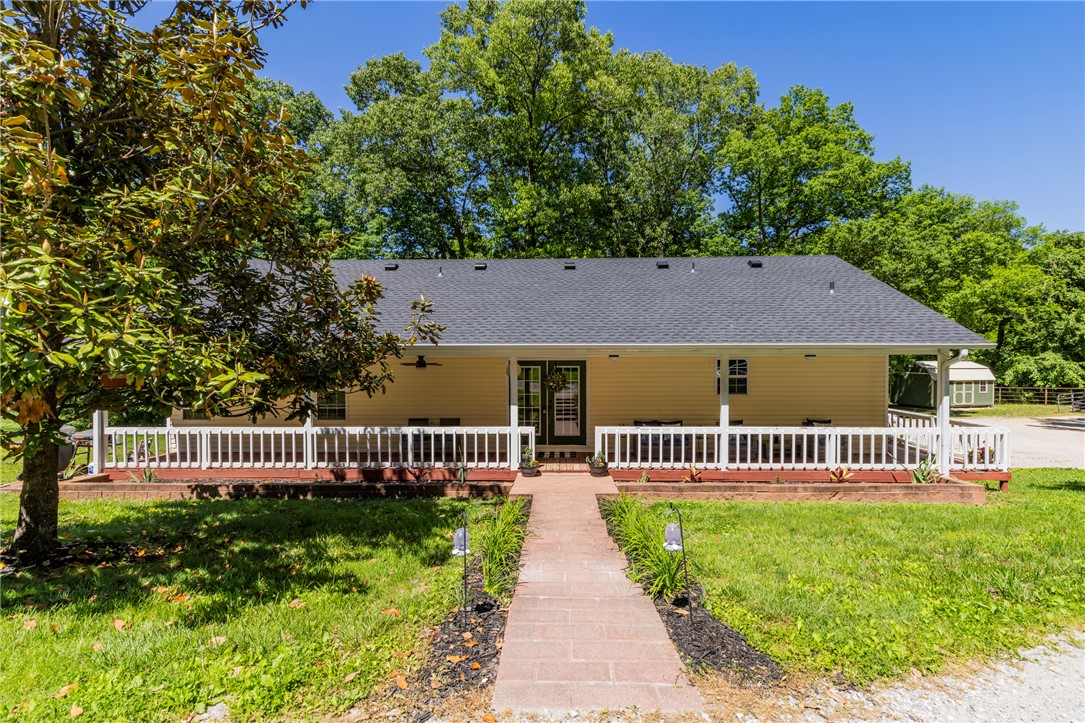 Deer in the yard, coffee on the porch, quick drive to Rogers. Tucked on 7.43 acres  just outside Rogers, this 3/2 is hard to find with room to breathe, a 40x50 shop on concrete, and the big stuff handled. New roof in 2026, septic in 2025, solar-ready, with a generator connection. Kitchen & baths remodeled 2025. Shop is clean and ready for whatever you need it for. Avoca town limits with county feel, no HOA. Preferred lender credit up to $3,000 w/Fairway Mortgage for qualified buyers. A convenient country escape beckons you​​‌​​​​‌​‌​​​‌‌​​​‌‌‌​​‌​​‌‌​​​​ home.