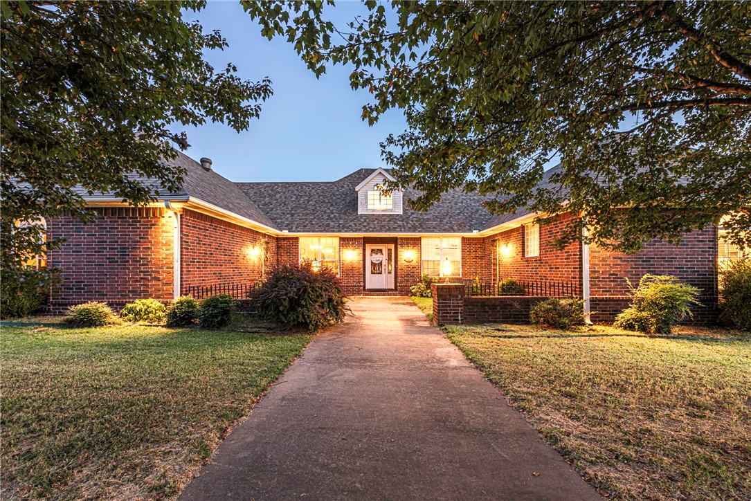 LOWER PAYMENTS for the first two years with preferred lender - 2-1 seller buydown up to $8,000 or closing costs! Check out this 4 bedrm 2.5 bathrm sitting on 0.54 acre +/- corner lot & located minutes away from Stonebridge Meadows Golf Course, Lake Sequoyah, Elkins, & East Fayetteville! From the front courtyard head inside to a formal dining rm w/ a trey ceiling & new florring that flow into the spacious main living room w/ Crown moulding, cased windows, & brick fireplace! Flow into the great room perfect for entertaining or as a play room! Flow into the L-shaped kitchen that features: ample cabinet space, built-in desk, stainless steel appliances, recessed lighting, and an eat-in dining space with lots of natural light & vaulted ceiling! Relax & rejuvenate in the primary bedrm w/ private ensuite bath feat: double sinks, separate tub & shower, & separate vanity cabinet! + Three Additional bedrms & one additional bathroom! Hang out on the back patio during the remainder of the warm weather! Don't miss out! Act now!