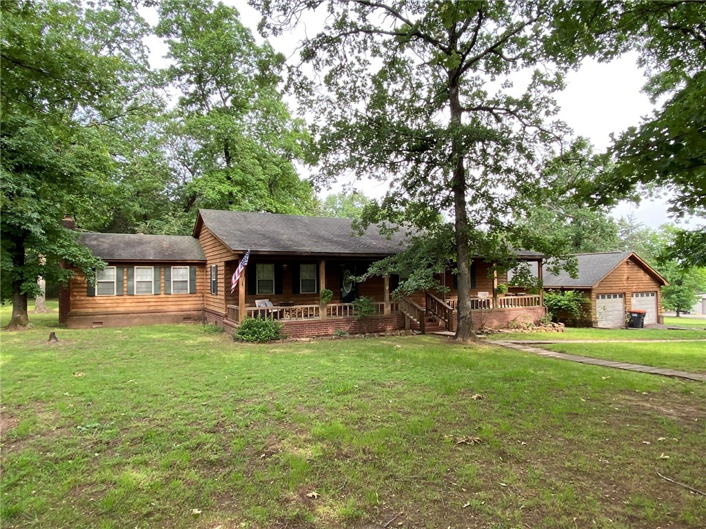 Charming county home with modern updates and a bonus room with wood stove.  This beautiful home has three bedrooms and two full baths. Just at the bottom of Mount Nebo State Park.  Contemporary open living space.  Beautiful remodeled kitchen. Brand new HVAC.  The property is 1.5 acres, perfect for relaxing, entertaining or gardening. Two car detached garage/work space. Move in ready, call to see it today.