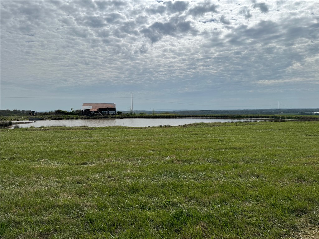15 Acres plus a pond! Beautiful views on blacktop road 15 minutes to Farmington & 15 minutes to Lincoln or Prairie Grove. Large, beautiful tracts with awesome views. Soil test has been done. Splits are completed. No mobiles or chicken houses. Rural water is available from Lincoln. More acreage available. Agent owned. Acreage is subject to change. See ML# 1342729, 1342731-1342736