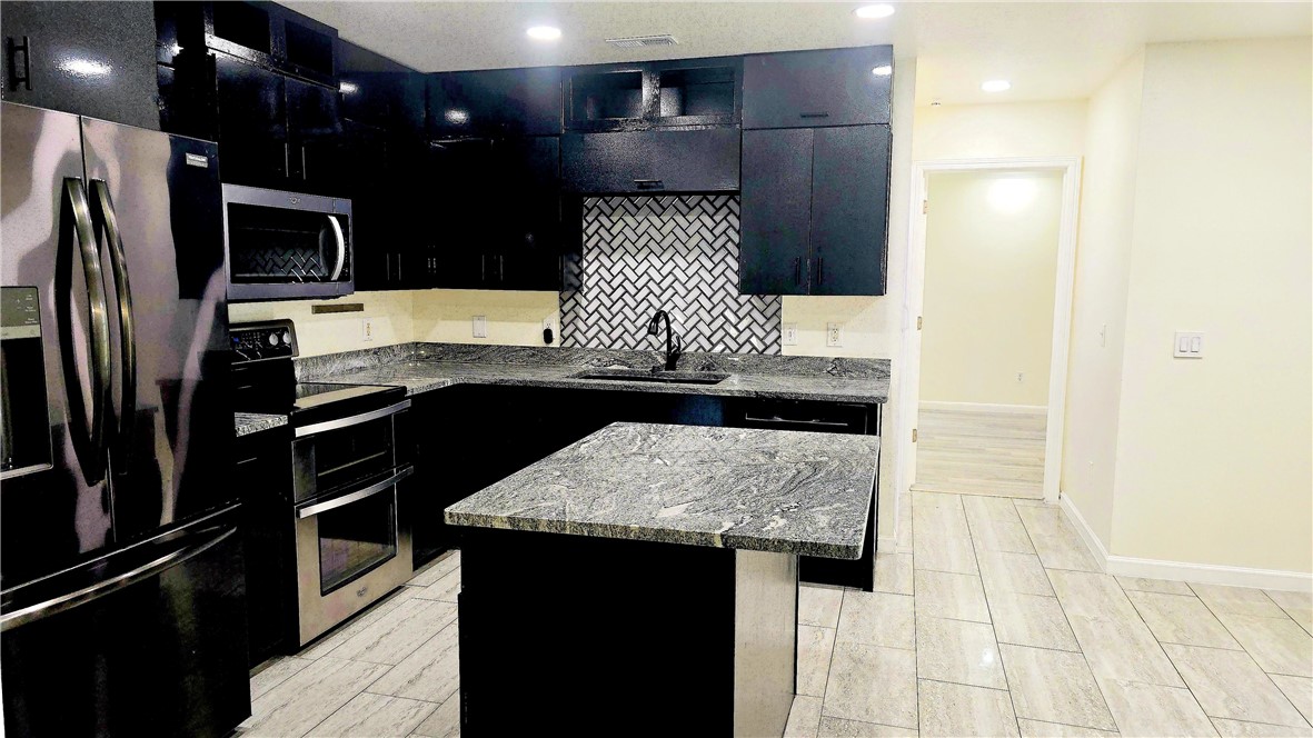 Welcome home to 207 E Post Rd, Rogers! This spacious 4-bedroom, 2-bath home is completely move-in ready with fresh paint and thoughtful updates throughout. Designed with a desirable split floor plan, it offers privacy for the primary suite while providing generous living space for everyone. Every bedroom features a walk-in closet, giving you storage that's hard to find.

Outside, you'll love the oversized backyard complete with a children's playset, a large workshop/storage shed with electricity and loft space, and a storm shelter capable of protecting up to 8 people for added peace of mind. The home is also solar ready, making it easy to add energy-efficient upgrades in the future. A spacious 2-car garage completes the package.

Conveniently located near top-rated schools, parks, shopping, restaurants, and everyday amenities, this home offers the perfect combination of space, functionality, and location. Don't miss your opportunity to make this exceptional Rogers home yours!